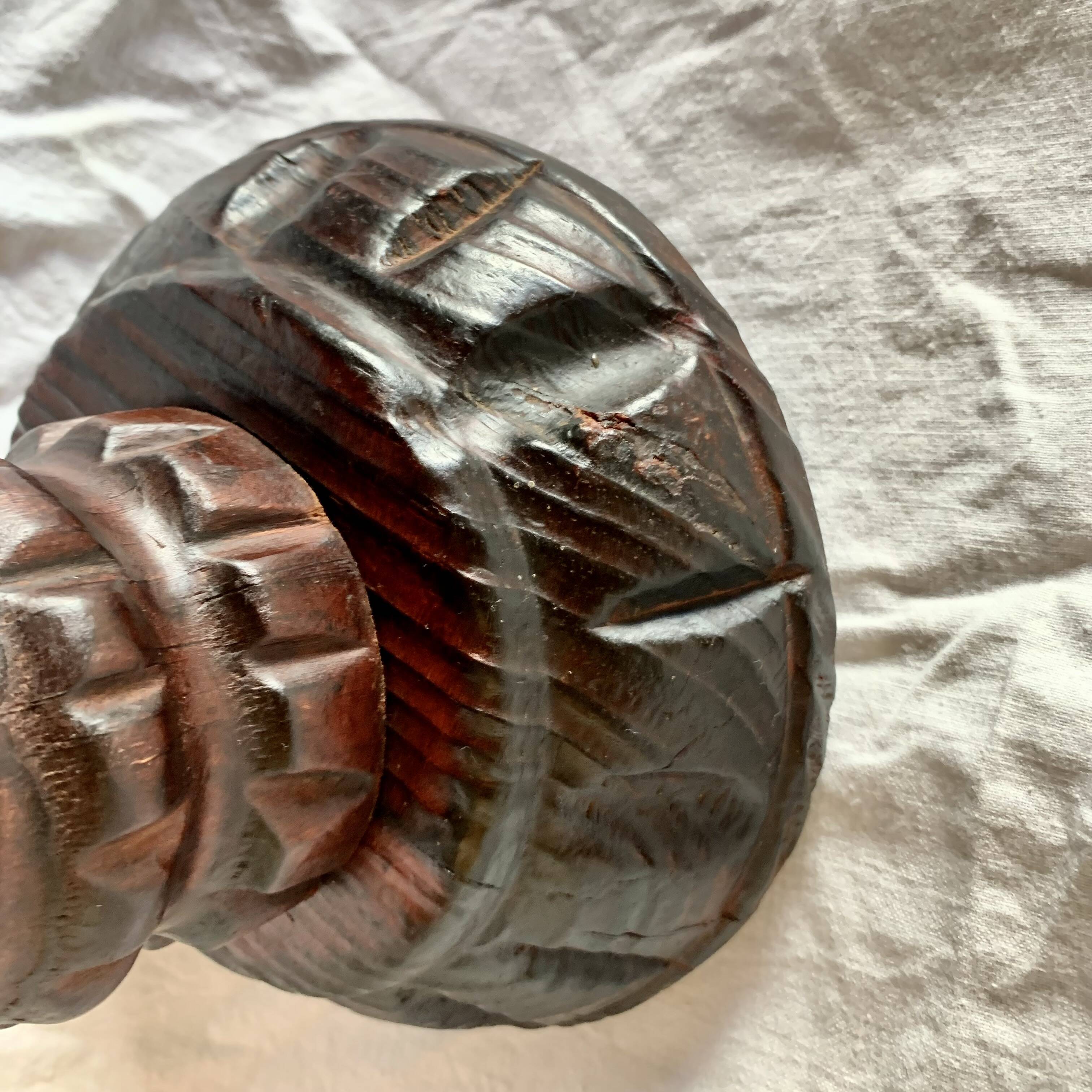 Old ashtray on carved wooden stand