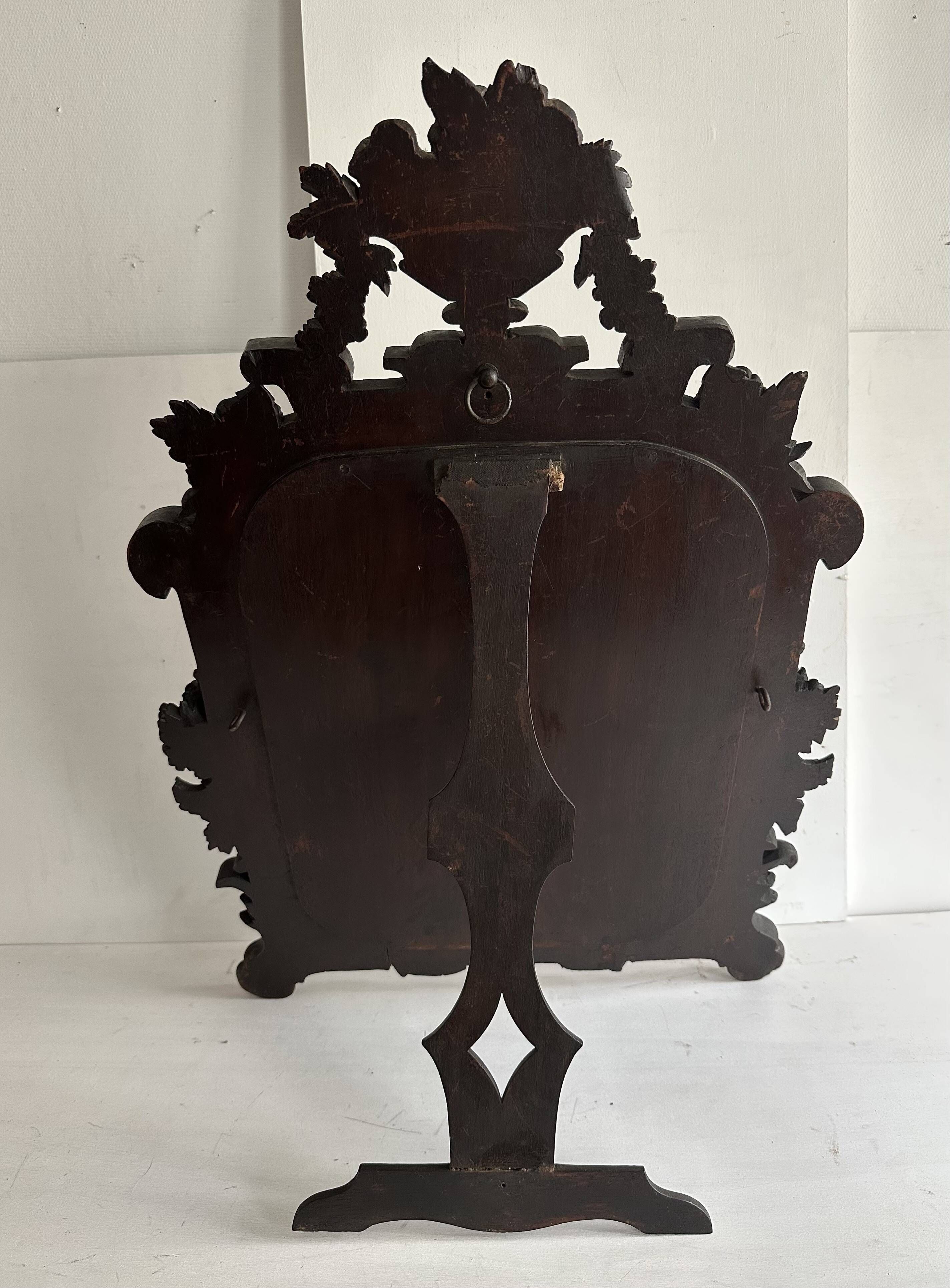 Napoleon III mirror in carved blackened wood, 19th century