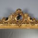 Antique eclectic style mirror in carved and gilded fir, Italy, 19th century.