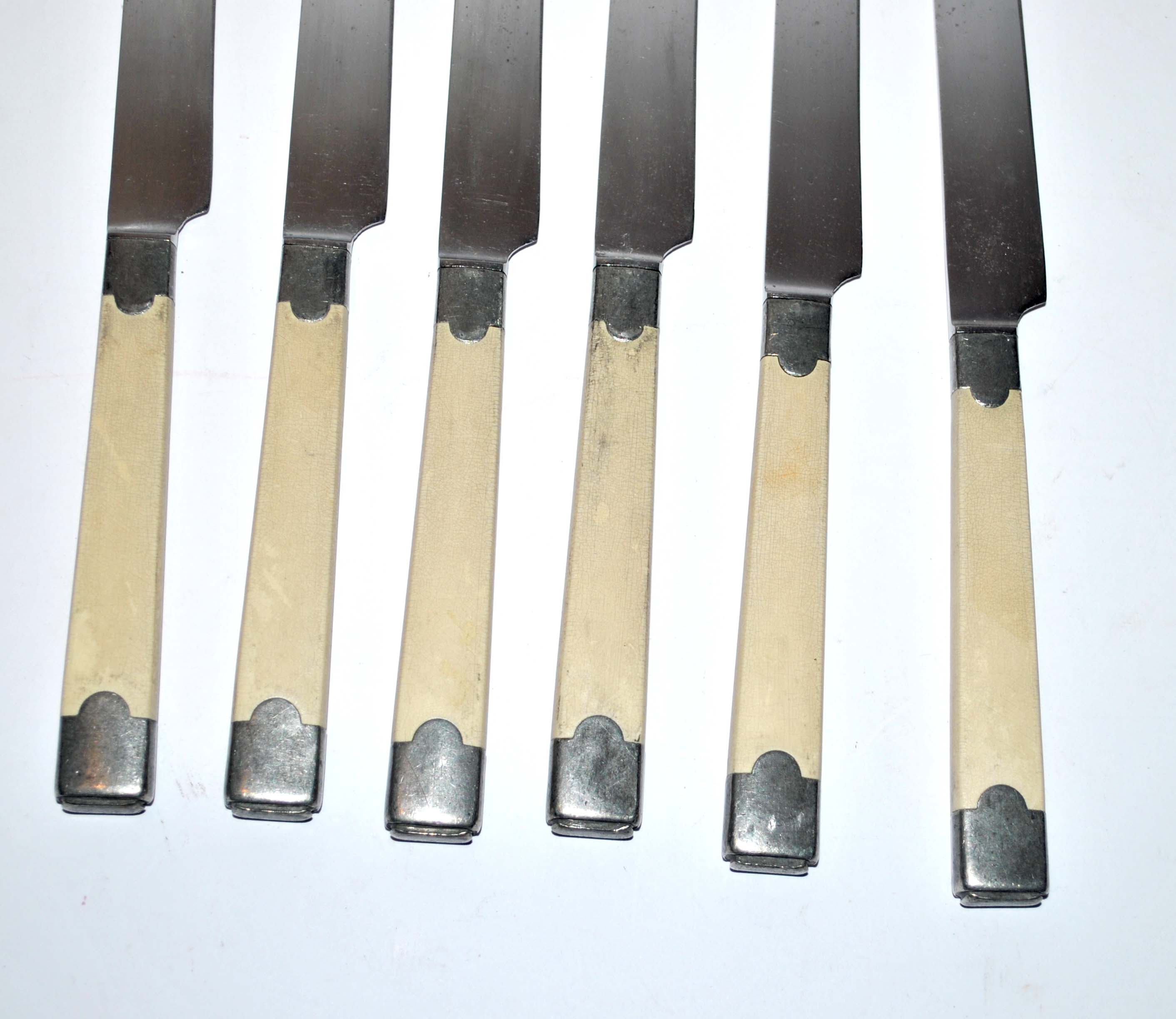 Series of 6 retro table knives in steel and ivory cracked lacquer 1940