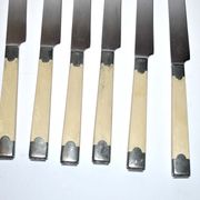 Series of 6 retro table knives in steel and ivory cracked lacquer 1940