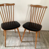2 baumann chairs seated in imitation black leather