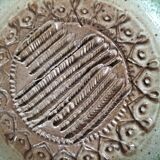 Signed stoneware bowl from Puisaye, relief decoration.