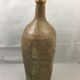 Old bottle in varnished sandstone glazed vintage