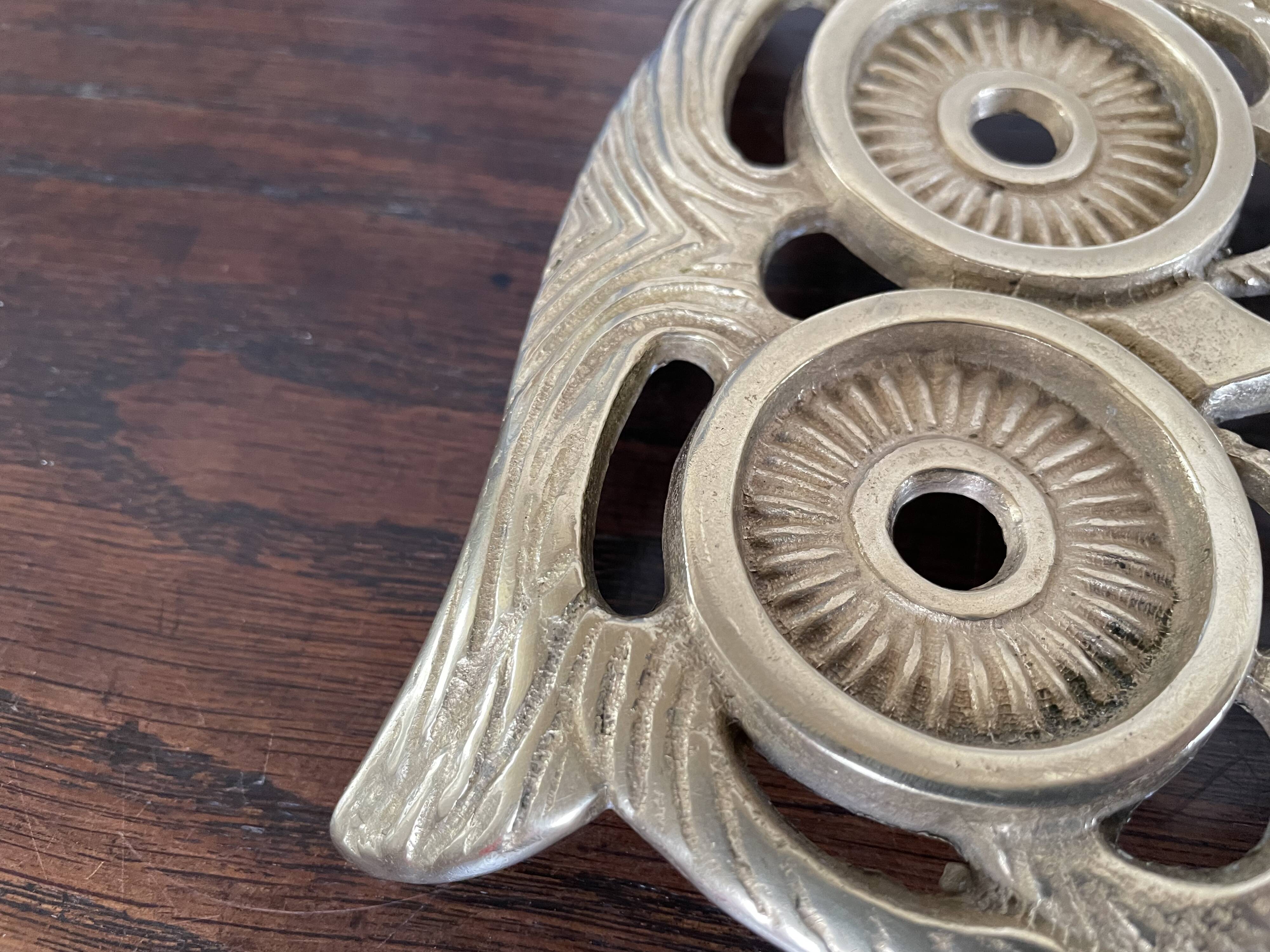 Owl trivet in golden brass