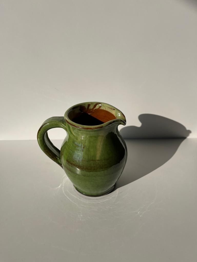 Green glazed ceramic pitcher