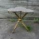 Louis XIII style gueridon, gilded legs, trilobed top.