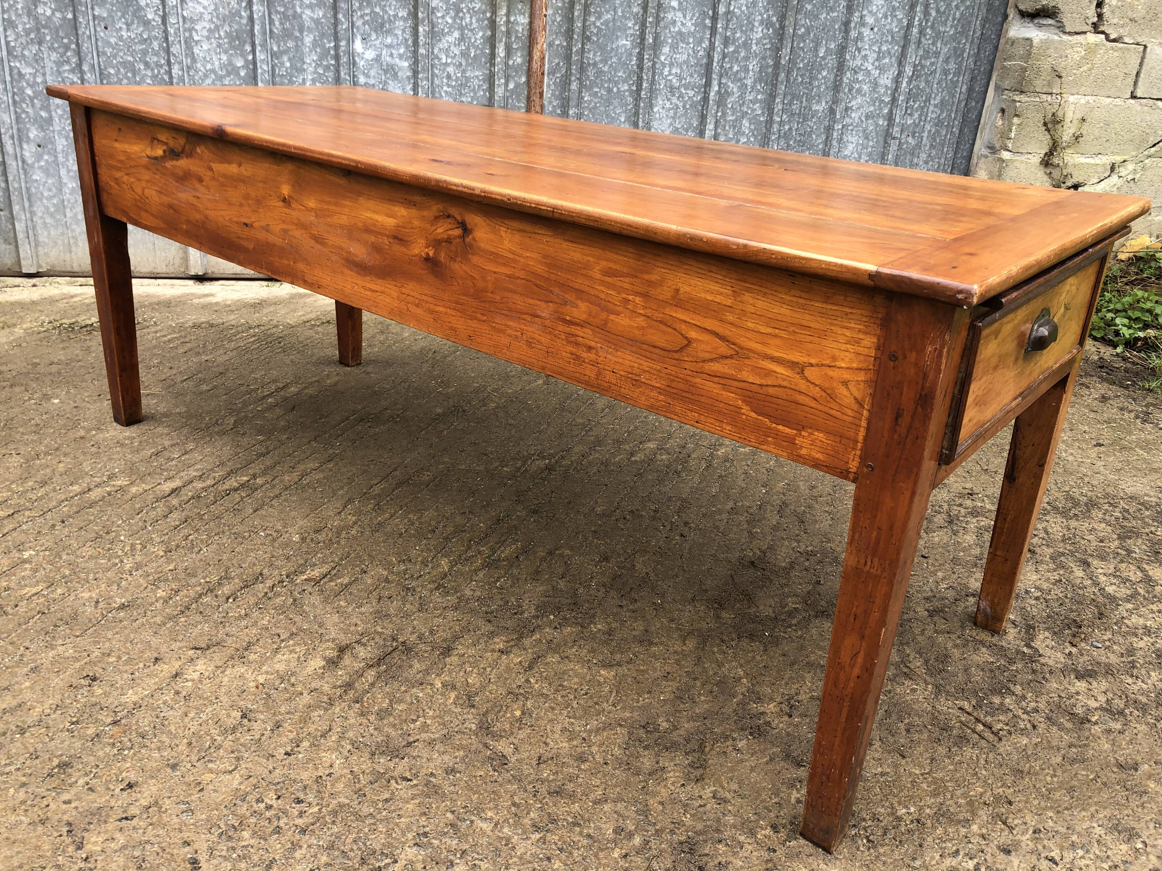 Antique farmhouse table in solid cherry wood with 3 drawers and 1 pull-out.