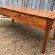 Antique farmhouse table in solid cherry wood with 3 drawers and 1 pull-out.