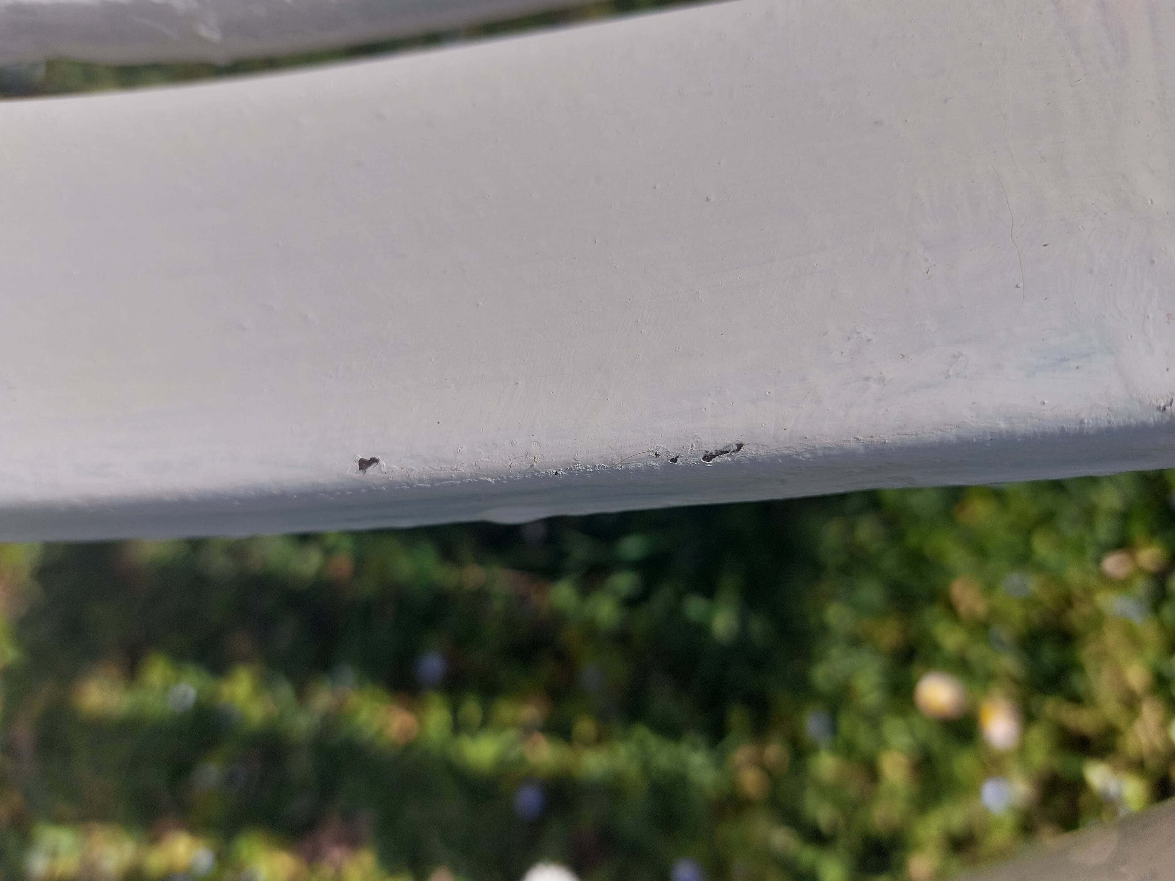 pair of white metal chairs, Tolix style