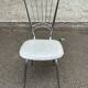 Vintage Scandinavian chair in steel and white leather from the 1950s.