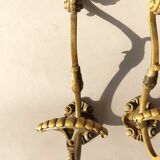 Pair of gilded bronze hooks Louis XVI style, nineteenth century.