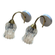 Pair of wall sconces in brass with transparent tulip glass shade.