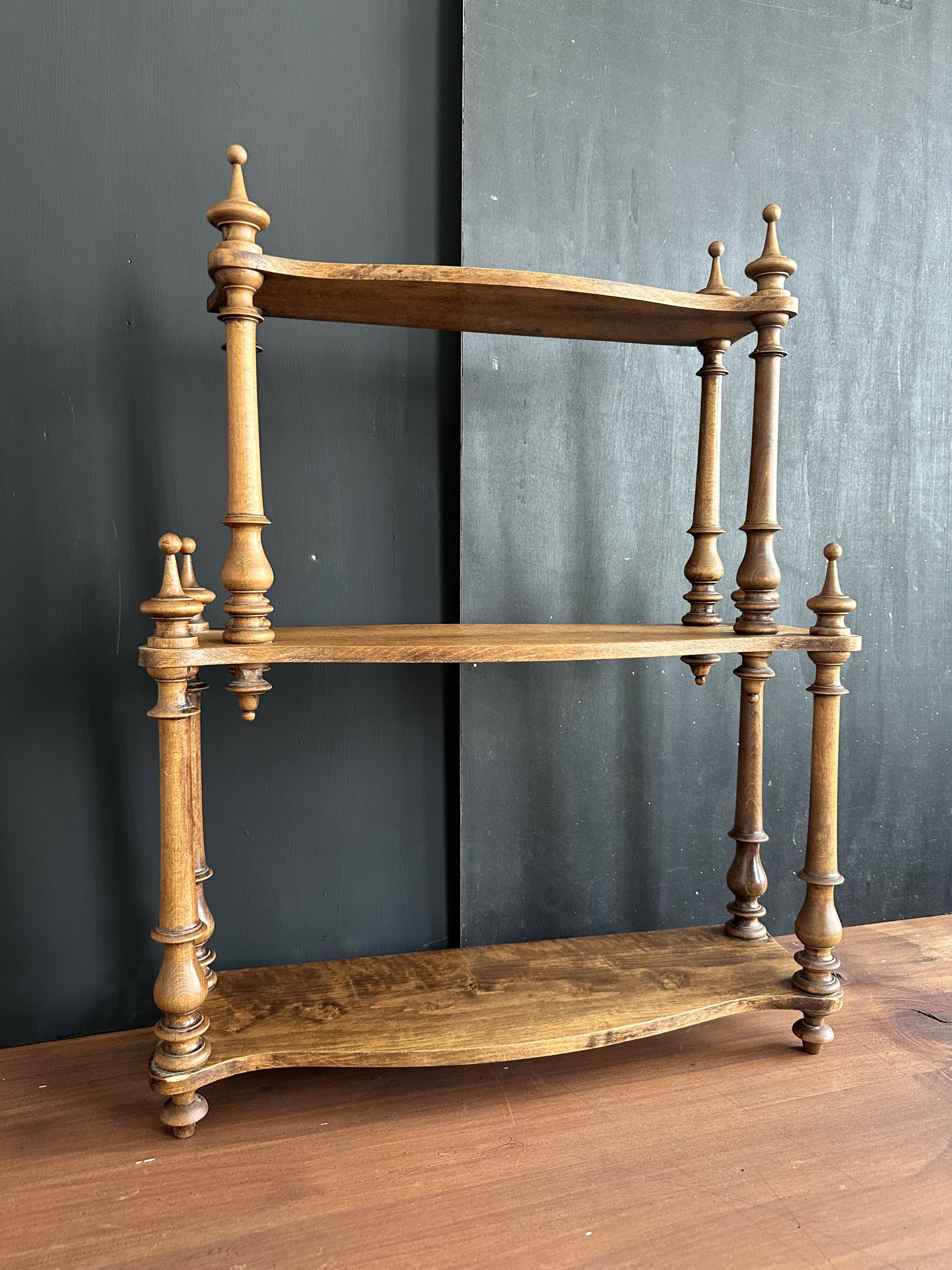 Antique turned wooden shelf with three levels, around 1900.