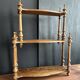 Antique turned wooden shelf with three levels, around 1900.