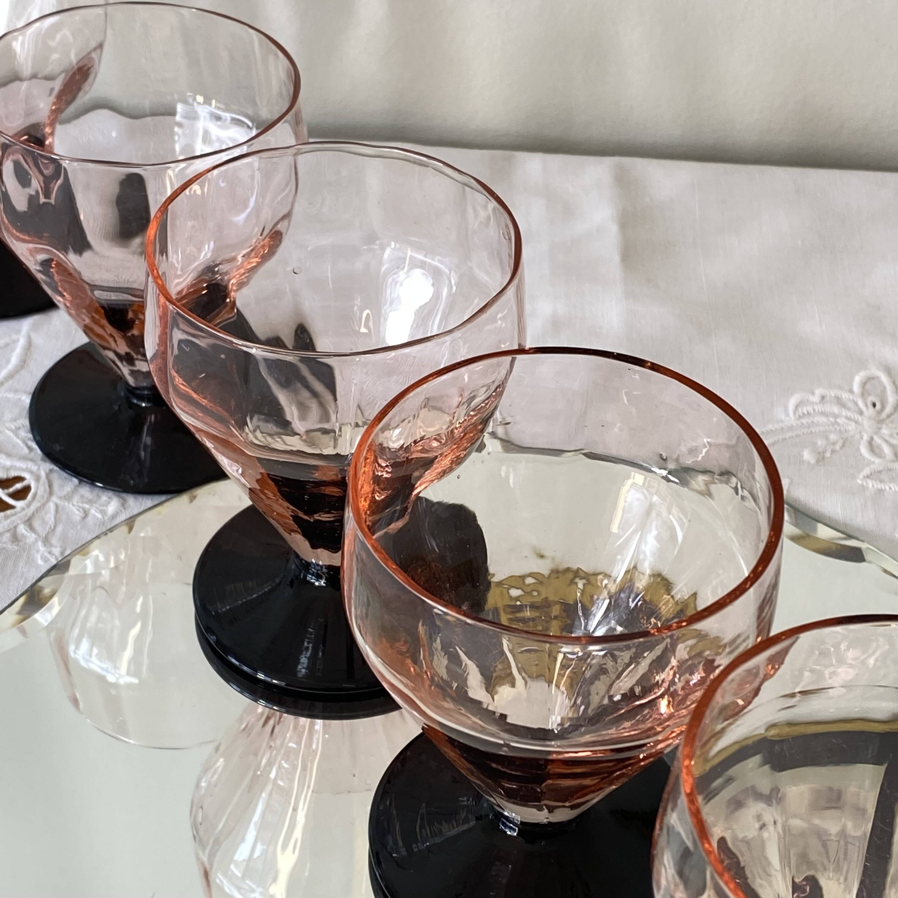 6 Art Deco pink wine or water glasses with black stems.