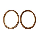 Pair of oval wooden frames with gilding
