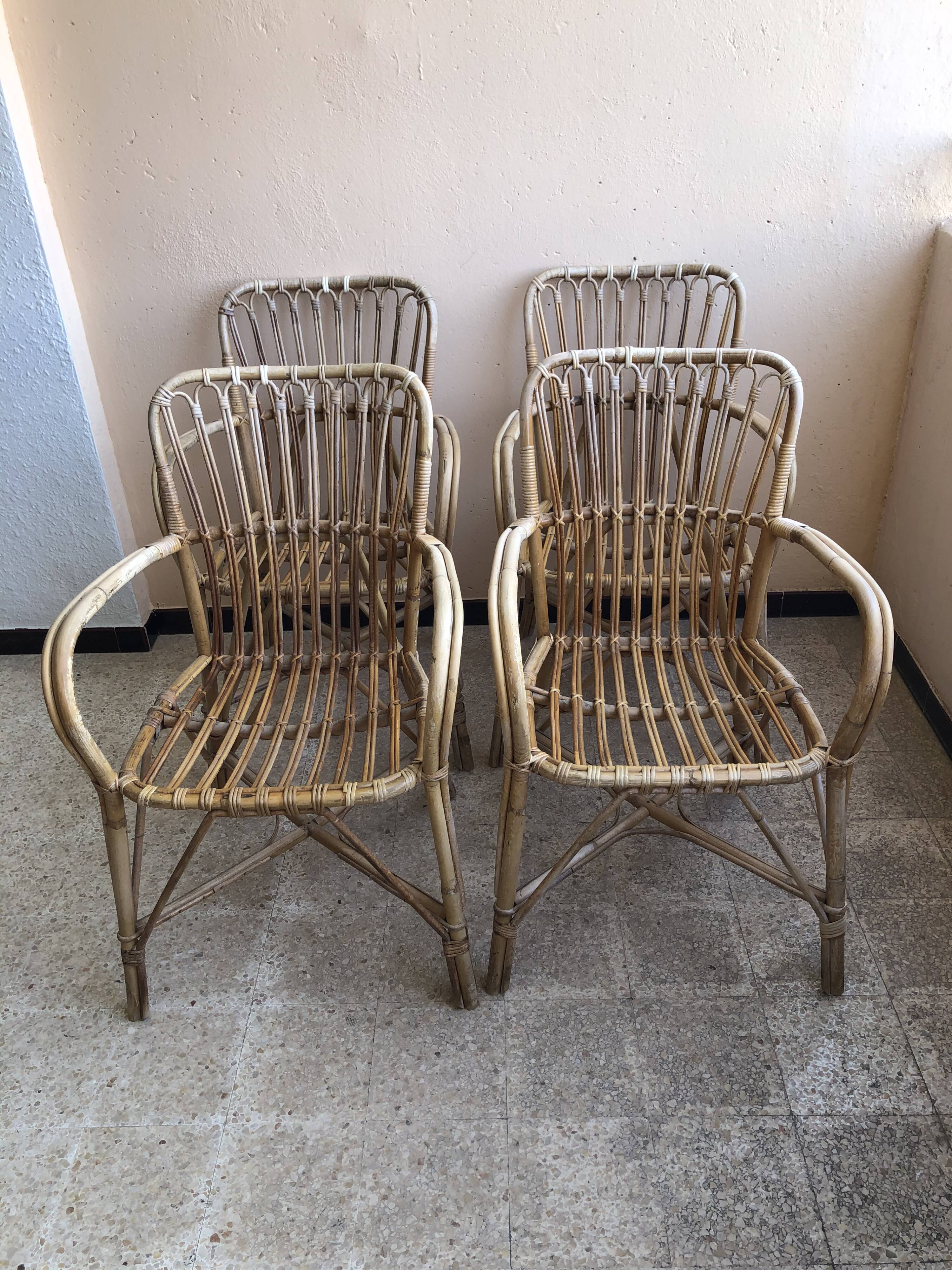 Series of 4 vintage rattan armchairs