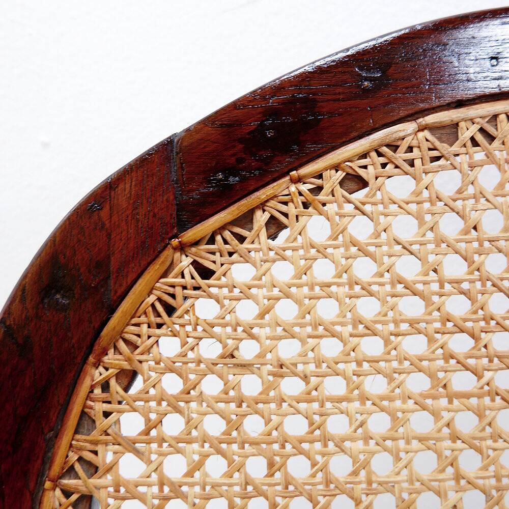 Art Deco armchairs in wood, with cane seat and backrest, circa 1930.