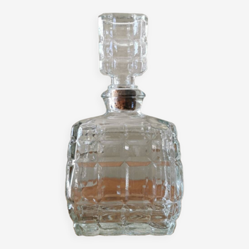 Glass carafe in the shape of a perfume bottle