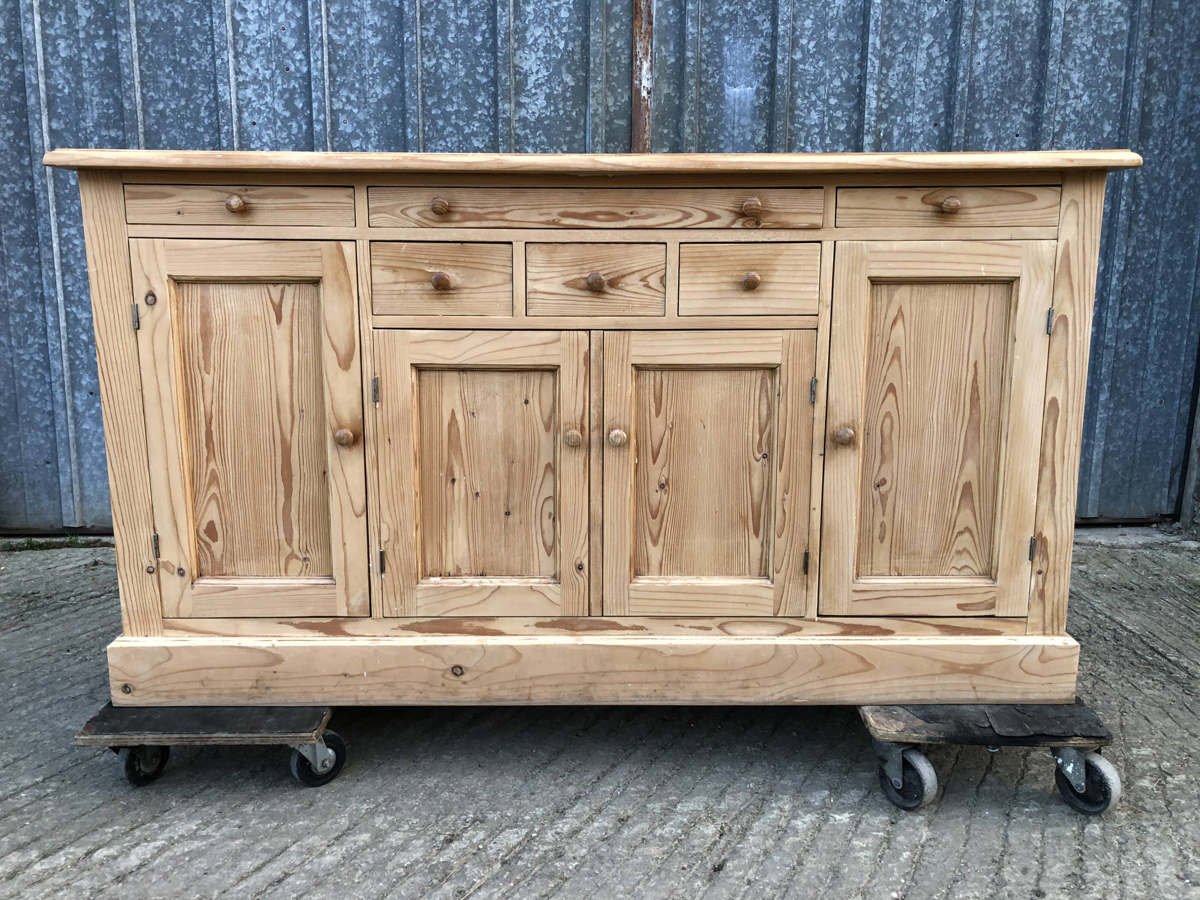 Scandinavian natural pine sideboard with 4 doors and 6 drawers.