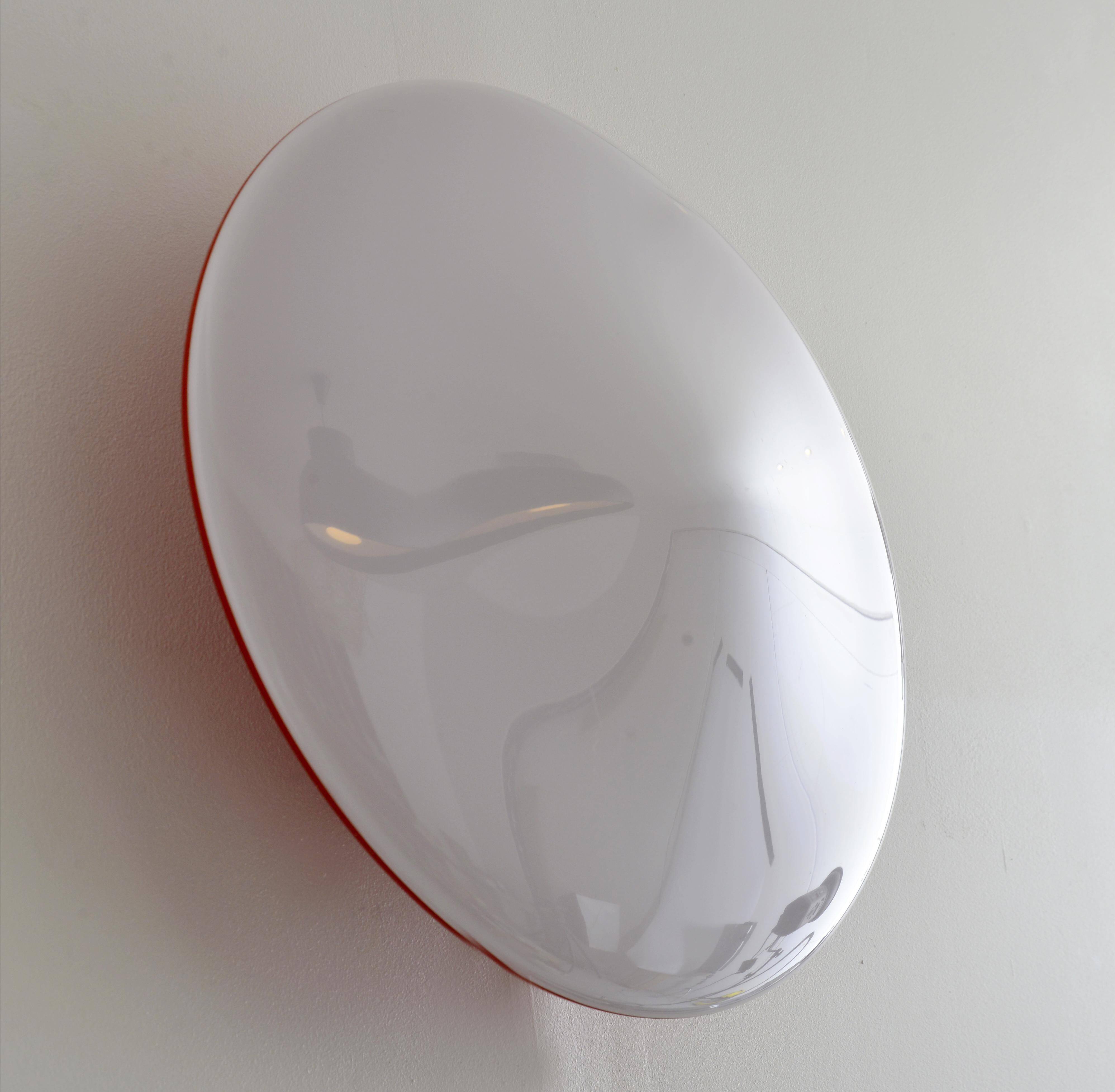 Oval wall lamp Artemide Italy design Patrick Jouin orange and white.