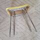 Vintage yellow leatherette stool from the 1950s