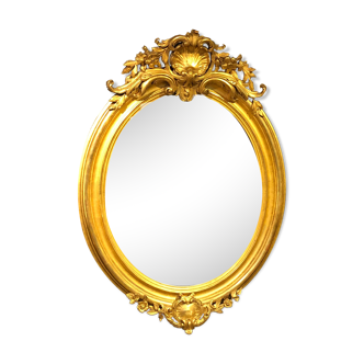 Golden oval mirror