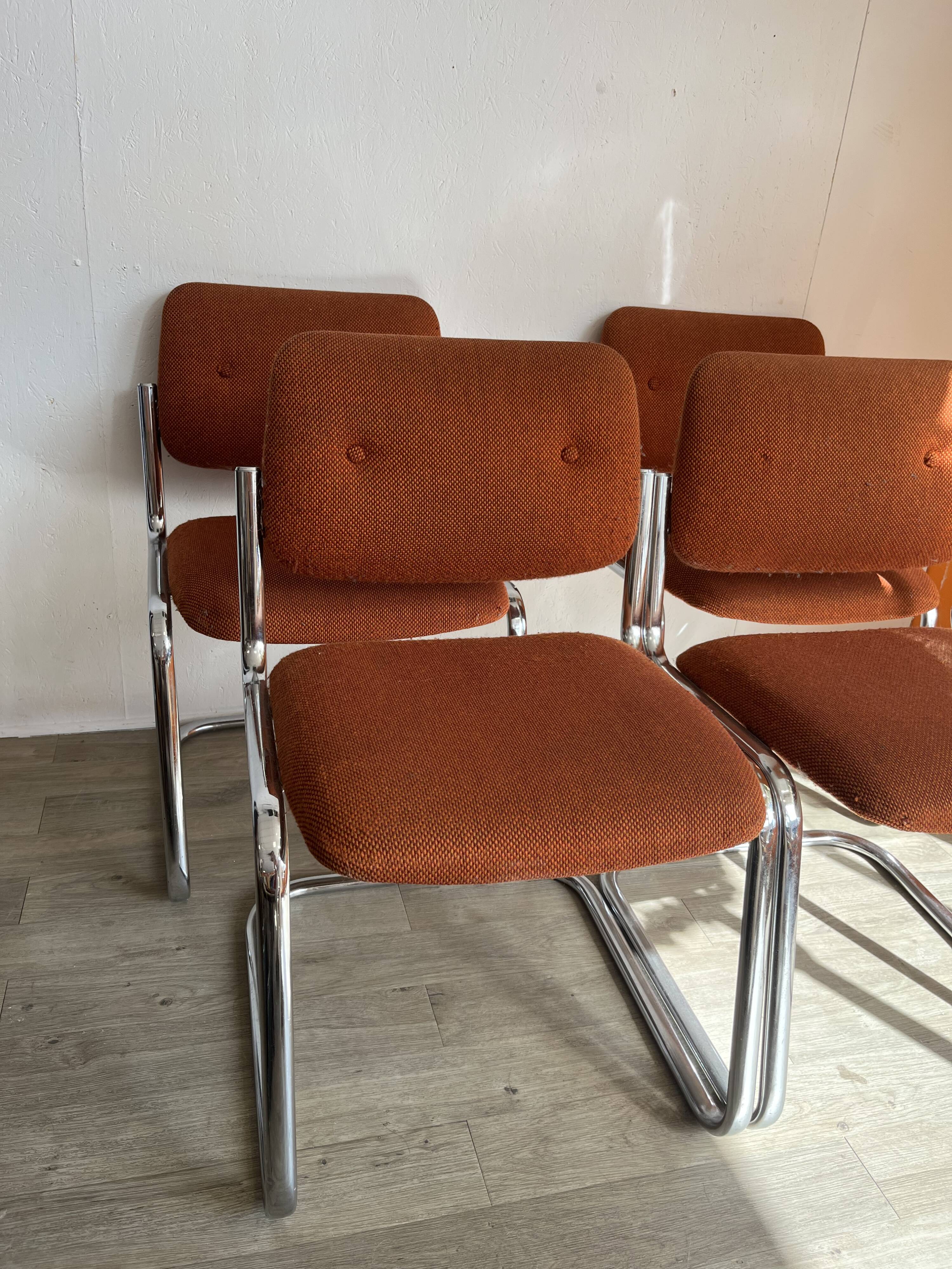 Vintage 70s orange tubular chairs