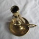 Anti-roll pendulum candlestick