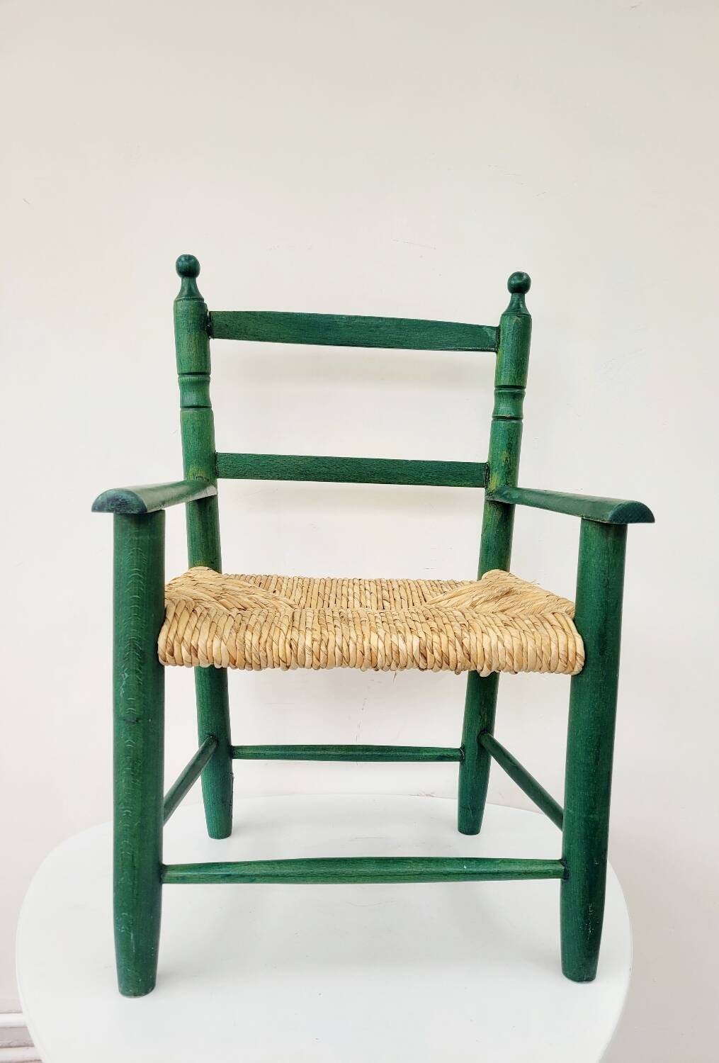 Small vintage children's chair in wood and green straw