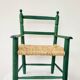 Small vintage children's chair in wood and green straw