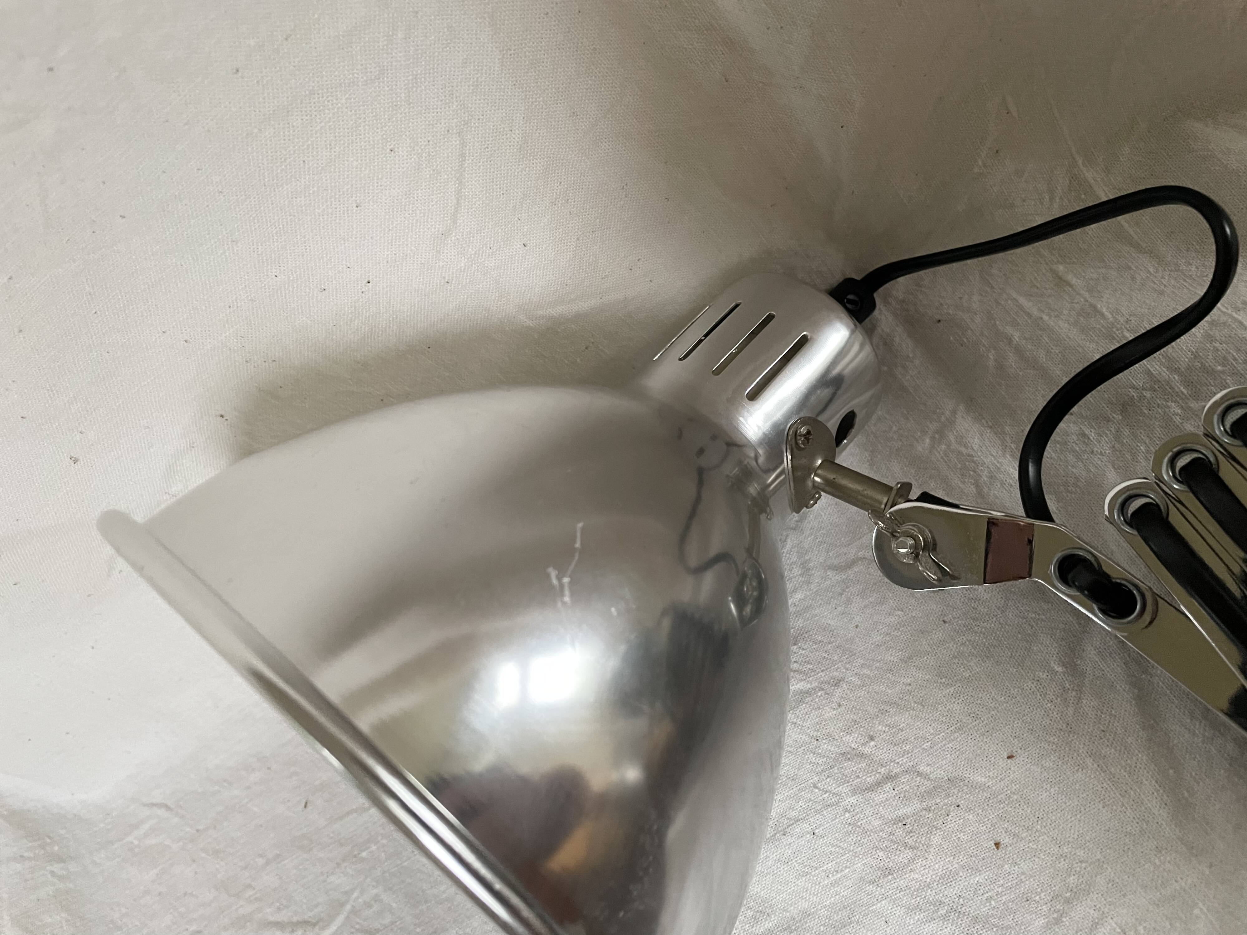 Vintage accordion wall light in chrome metal.