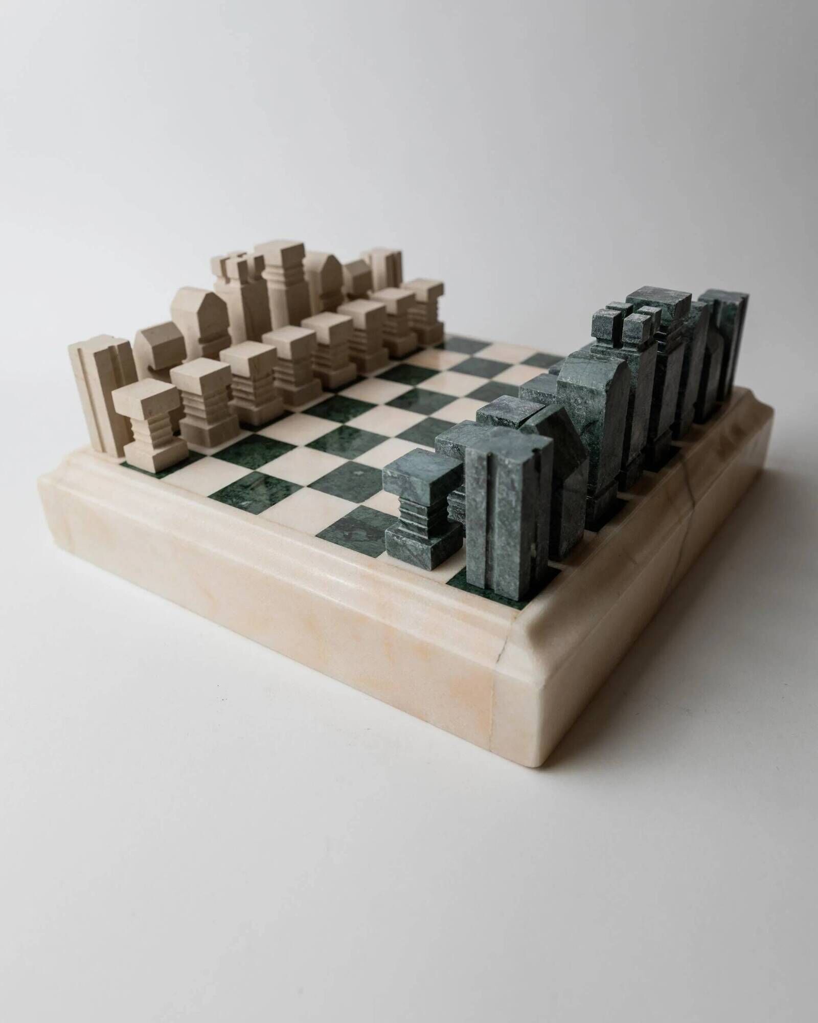 Vintage marble chess set from the 1970s, green and beige stone board, heavy design, geometric pieces, sculptural tabletop game, gift idea.