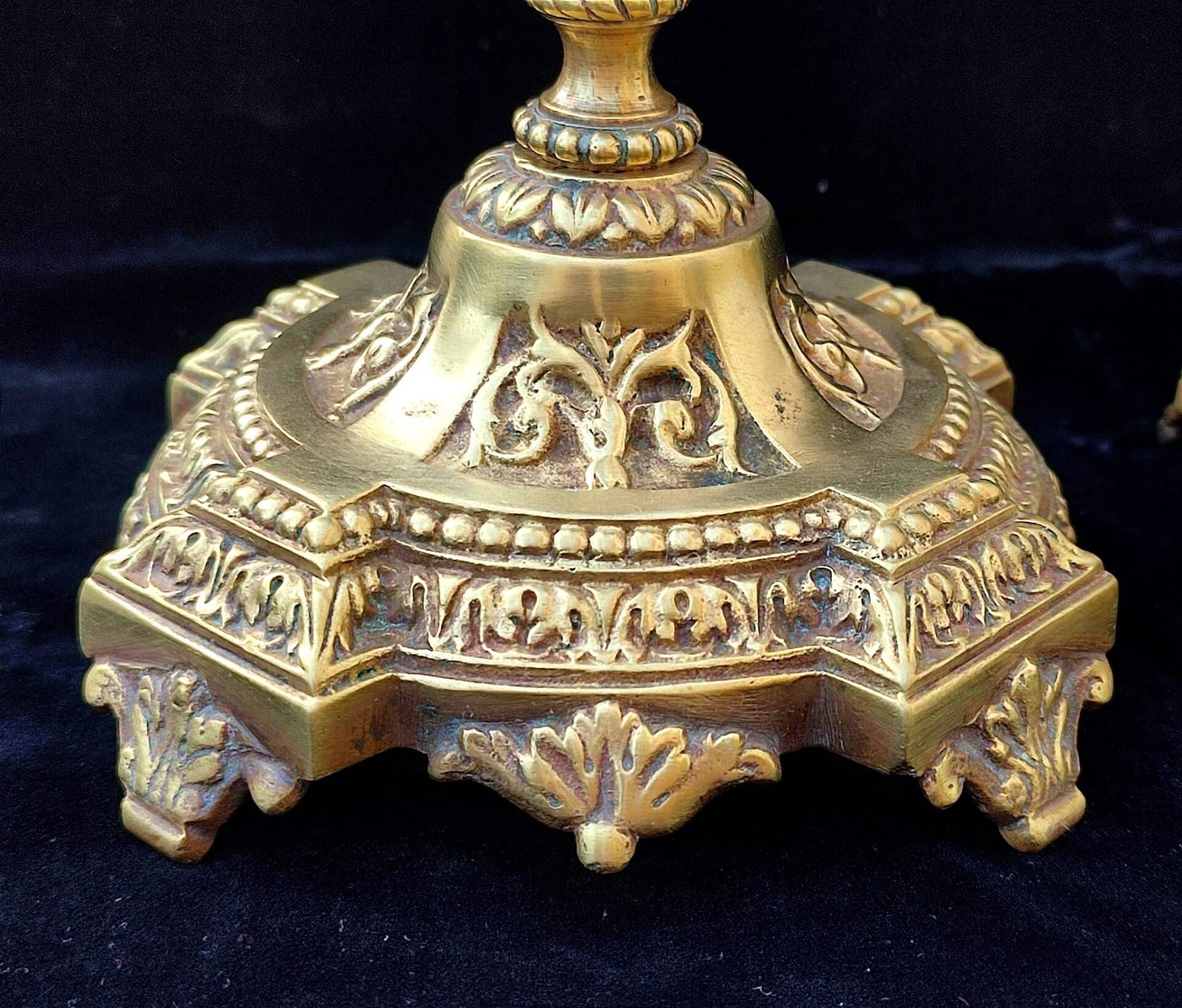 Pair of antique carved bronze candlesticks.