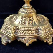 Pair of antique carved bronze candlesticks.