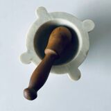 Old marble mortar with wooden pestle