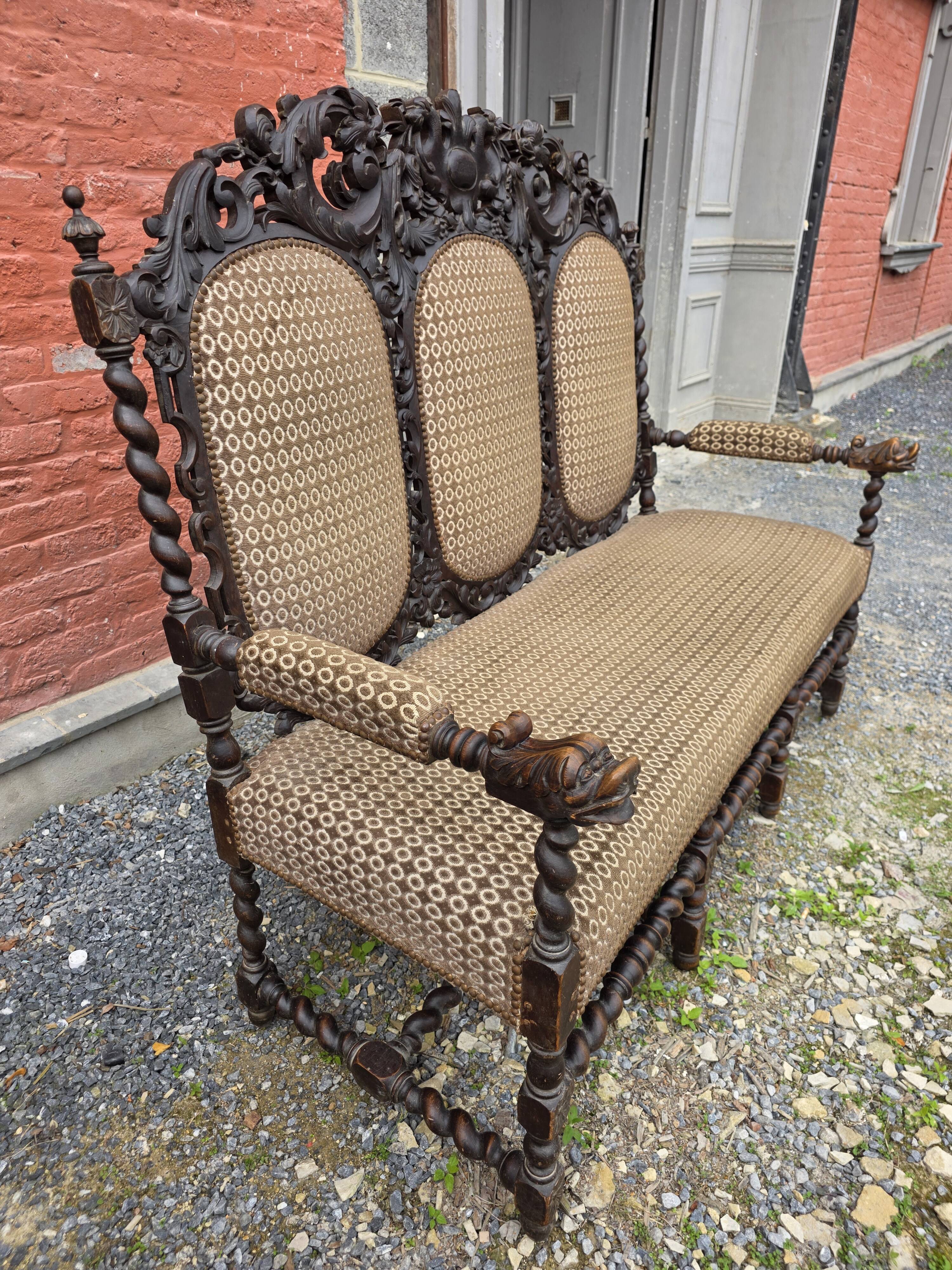 Three-seater armchair in Louis XIII style made of oak from the 19th century.