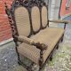 Three-seater armchair in Louis XIII style made of oak from the 19th century.