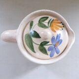 Old earthenware pitcher with its lid