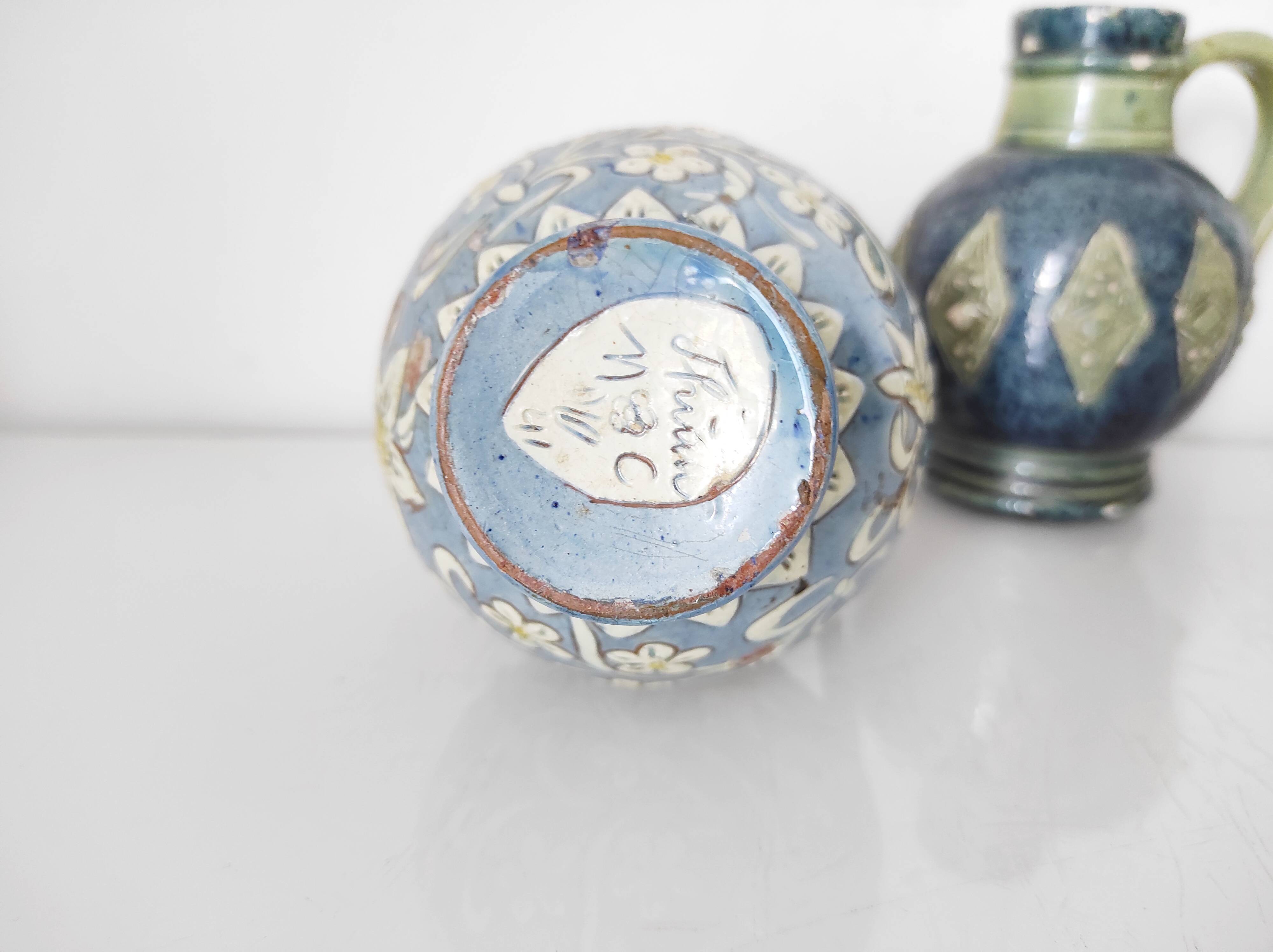 Two small blue ceramic vases