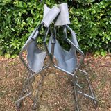 Pair of folding metal and leather armchairs