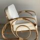 Large rattan rest chair and white cushions