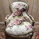 Reupholstered bergère with floral fabric in Louis XVI style.