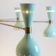 Contemporary 12-light diabolo-shaped radiant chandelier.