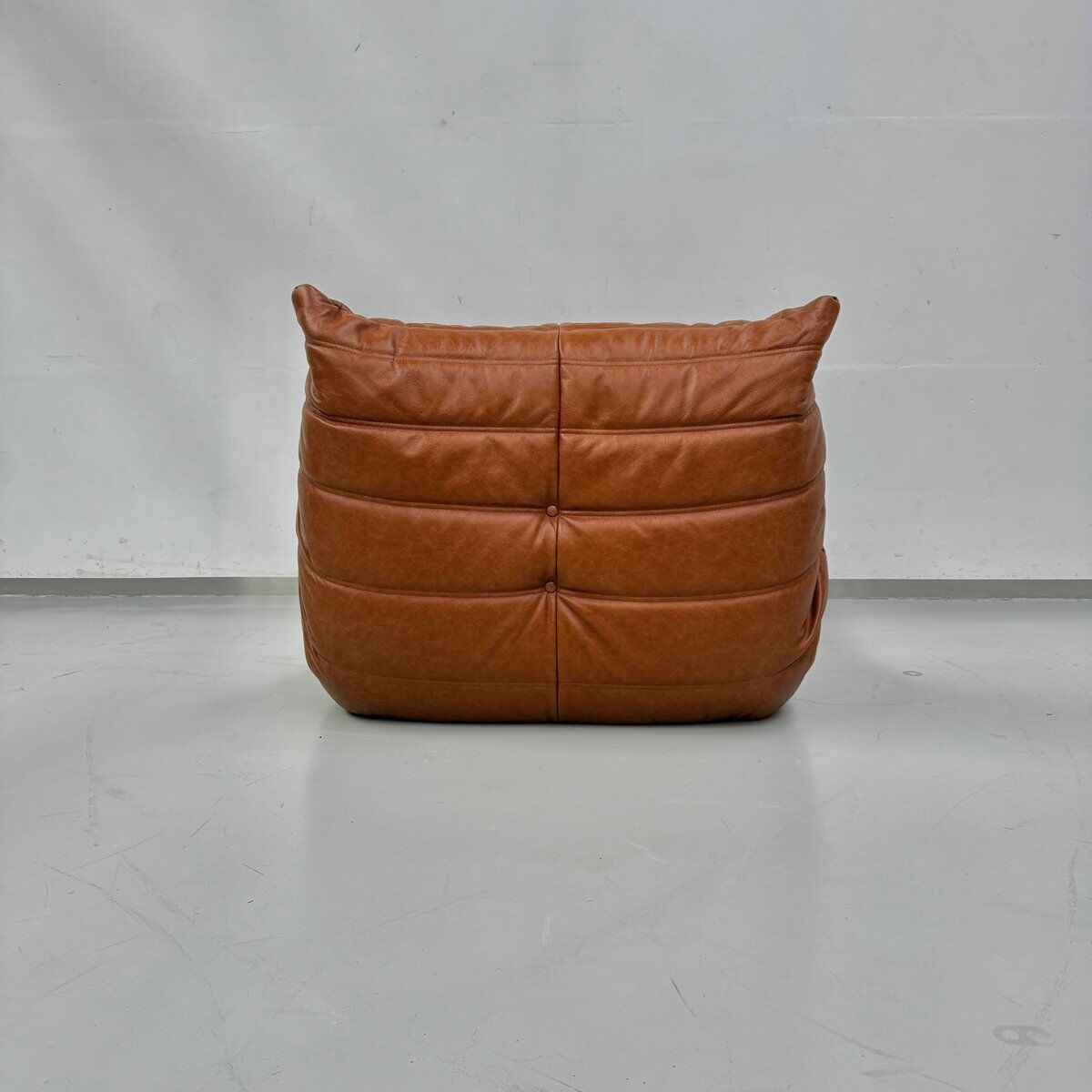 Togo Chair in Cognac Leather attributed to  Michel Ducaroy for Ligne Roset.