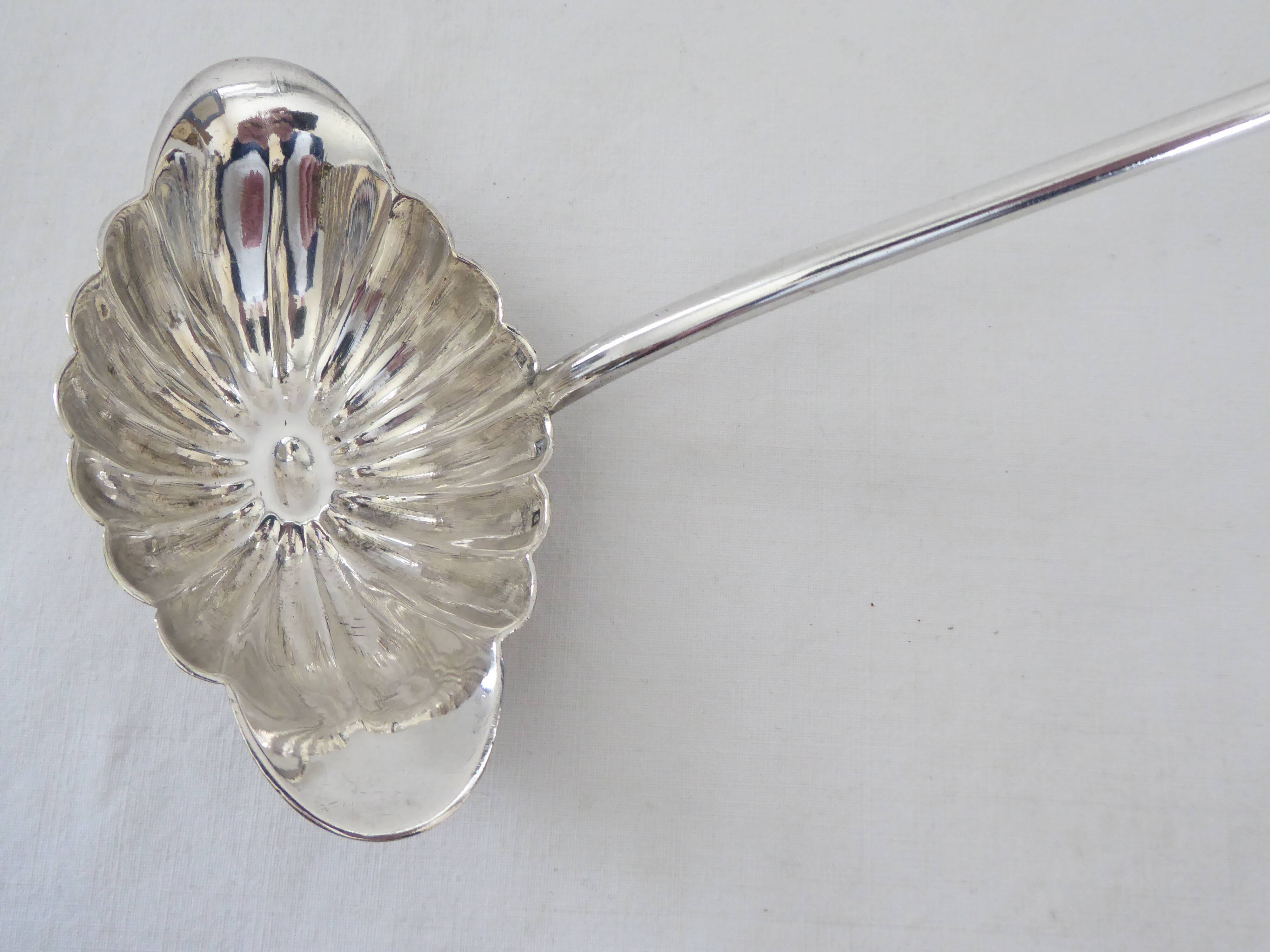 Silver metal sauce ladle