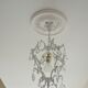 Brass chandelier with patinated tassels