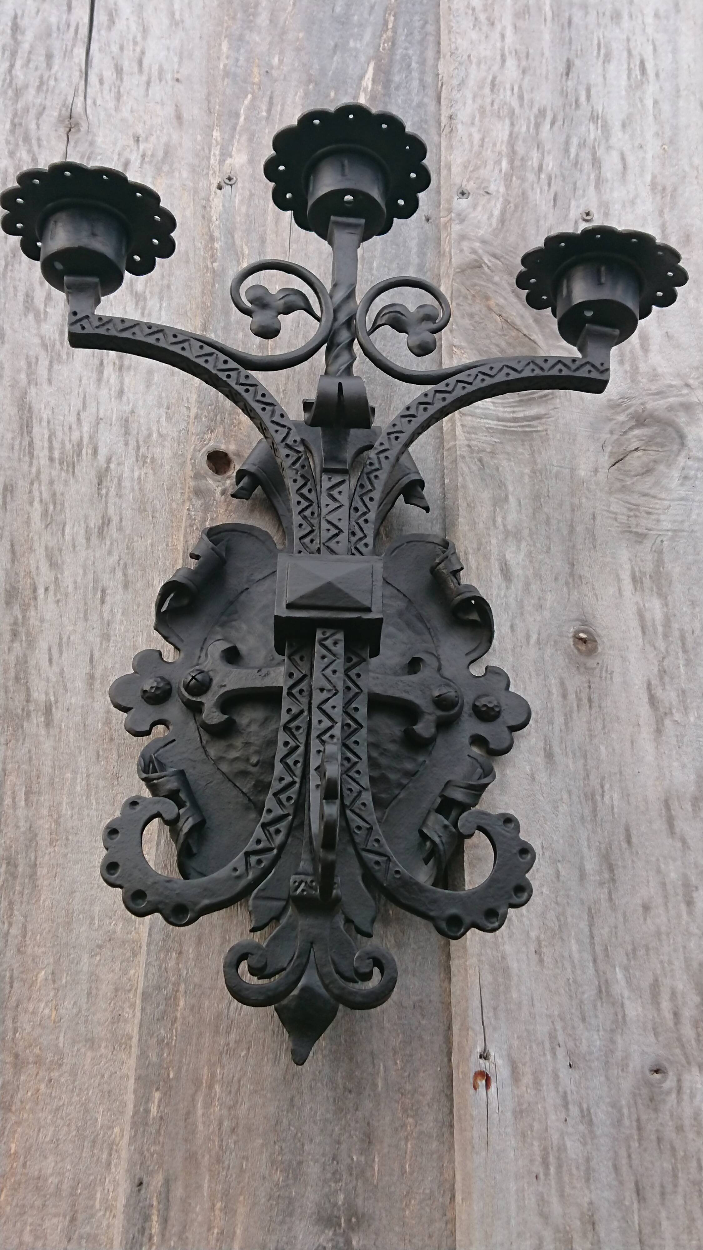 Pair of black wrought iron sconces - neo-Gothic style - from the 1950s