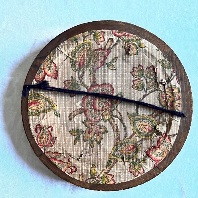 Witch's mirror with wood frame and curved ice